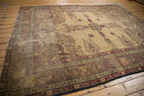 Corner of antique Kermanshah carpet, showing intricate millefleur spandrels, curvilinear borders, and time-softened abrashes.
