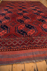 Ersari carpet's plain weave end, accented with blue stripes and light fringe.