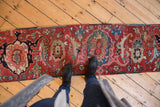 Antique Serapi runner's cherry red, blue, ivory samovar and palmette pattern, with mostly even wear.