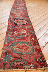 Hand-knotted antique Serapi runner detail: cherry red field with sapphire blue palmettes and floral motifs.