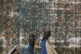 Vintage distressed Bibikabad carpet showing ocean blue Herati motif with worn foundation.