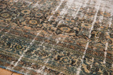 Vintage Distressed Bibikabad rug pile, showing ocean blue, camel Herati motifs, with foundation visible.