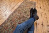 Vintage distressed Hamadan runner fragment with worn Herati motif in blush and seafoam.