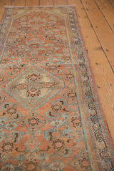 Distressed vintage Hamadan runner's Herati motif in blush, seafoam, ivory, with even wear.