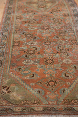 Patinaed texture and worn Herati motifs on a vintage Hamadan runner in blush and seafoam.