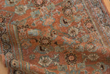 Distressed texture of vintage Hamadan runner, showing blush, seafoam, ivory Herati motif and wear.