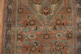 Distressed Persian Hamadan rug detail: Herati motif with dusty rose, seafoam, and even wear.
