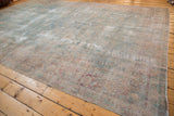 Vintage Yazd carpet corner with faded powder blue, dusty cochineal floral pattern and mostly even wear.