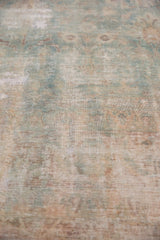 Mostly even wear showing foundation through faded powder blue and cochineal floral patterns.