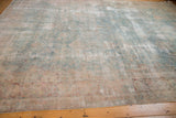 Faded powder blue, cochineal floral patterns and wear visible on Yazd rug.