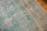 Vintage Yazd carpet showing faded powder blue and cochineal floral patterns with even wear.