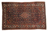 Vintage Persian Tajabad rug, navy and madder red Herati field, diamond medallion, pomegranate border.