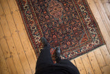 Traditional Persian Tajabad rug, rich in navy, madder root red, and ivory Herati motif.