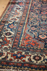 Hand-knotted Herati motif field and ornate madder root red border on vintage Tajabad rug.