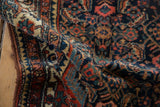 Vintage Persian Tajabad rug: short pile with navy, madder red, ivory Herati motif.