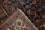 Hand-knotted back and madder red pomegranate border of vintage Tajabad rug.