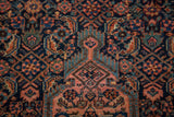 Herati motif on the vintage Tajabad rug, displaying navy, madder root red, and sky blue.