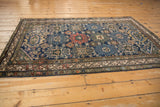 Vintage Malayer rug: antique ivory meandering vine main border, navy field palmette motifs.