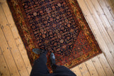 Vintage Malayer rug with dense navy Herati motif and a vibrant floral main border.