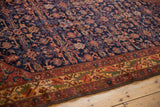Intricate Herati pattern and floral border detail of a vintage Malayer rug.