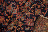 Hand-knotted Malayer rug with unique navy, gold, blush Herati motif and visible woven back.