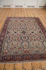 Antique Farahan Sarouk rug's intricate samovar turtle design, featuring ivory, madder root red, and navy blue.
