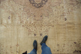 Vintage distressed Sivas carpet with faded floral patterns underfoot on an abrashed field.