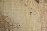 Distressed vintage Sivas carpet pile, abrashed ivory field with faded tone-on-tone flowers.