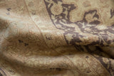 Distressed pile and tone-on-tone floral motifs in ivory and charcoal on a vintage Sivas carpet.