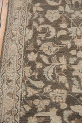 Textured pile of distressed Hamadan rug runner, showing charcoal vinery and ivory border.