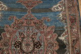 Distressed Malayer rug detail with madder root scrolling contours, indigo field, and side selvage.