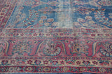 Vintage Yezd carpet's raspberry red border with elongated vinery and intricate blossoms.