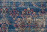 Intricate vinery and blossoms in indigo and cochineal on vintage Yezd, showing foundation.