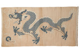 Vintage hand knotted Tibetan rug featuring a five claw dragon in dusty blues and soft beige.