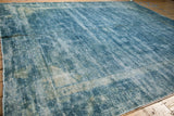 Vintage distressed Peking carpet, showing wear to foundation and knot heads in varied blue tones.