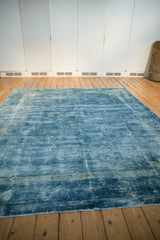Vintage distressed Peking carpet texture, with worn pile and soothing shades of blue.