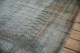 Distressed texture of the vintage Malayer carpet showing wear to the knot heads.