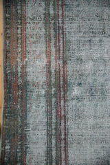Distressed weave of a vintage Malayer carpet with wear down to the knot heads and foundation.