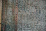 Extreme wear on a vintage Malayer carpet, showing the exposed cotton foundation and knot heads.