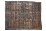 Distressed vintage Persian Meshed rug, roundel floral medallion, faded deep red and blue.