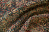 Distressed vintage Meshed carpet pile, scrolling floral vinery in wine, teal, foundation showing.