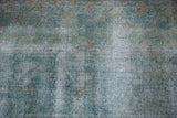 Distressed Kerman carpet texture with exposed foundation and faded floral motifs.