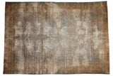 Distressed Kerman carpet, faded tree of life pattern, muted blues, golds, worn pile.
