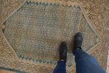 Faded allover Herati motif and serrated diamond shape on vintage distressed Malayer rug.