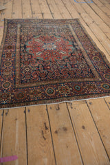 Antique Farahan Sarouk rug: navy and red floral border, Herati field, mostly even wear.