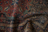 Antique Farahan Sarouk rug with madder red, navy Herati motifs, and visible foundation.