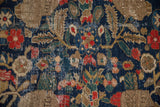 Navy and beige field of vintage Hamadan rug with pomegranate motif and mostly even knot wear.
