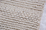 Undyed pure wool loops showing the Snow rug's chunky hand-woven texture.