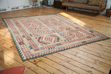 New Kilim carpet's flatweave with geometric border in red, blue, and dark green.