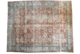 Vintage distressed Tabriz carpet with oversize palmettes and vase motifs in celadon red, sky blue, and beige.
